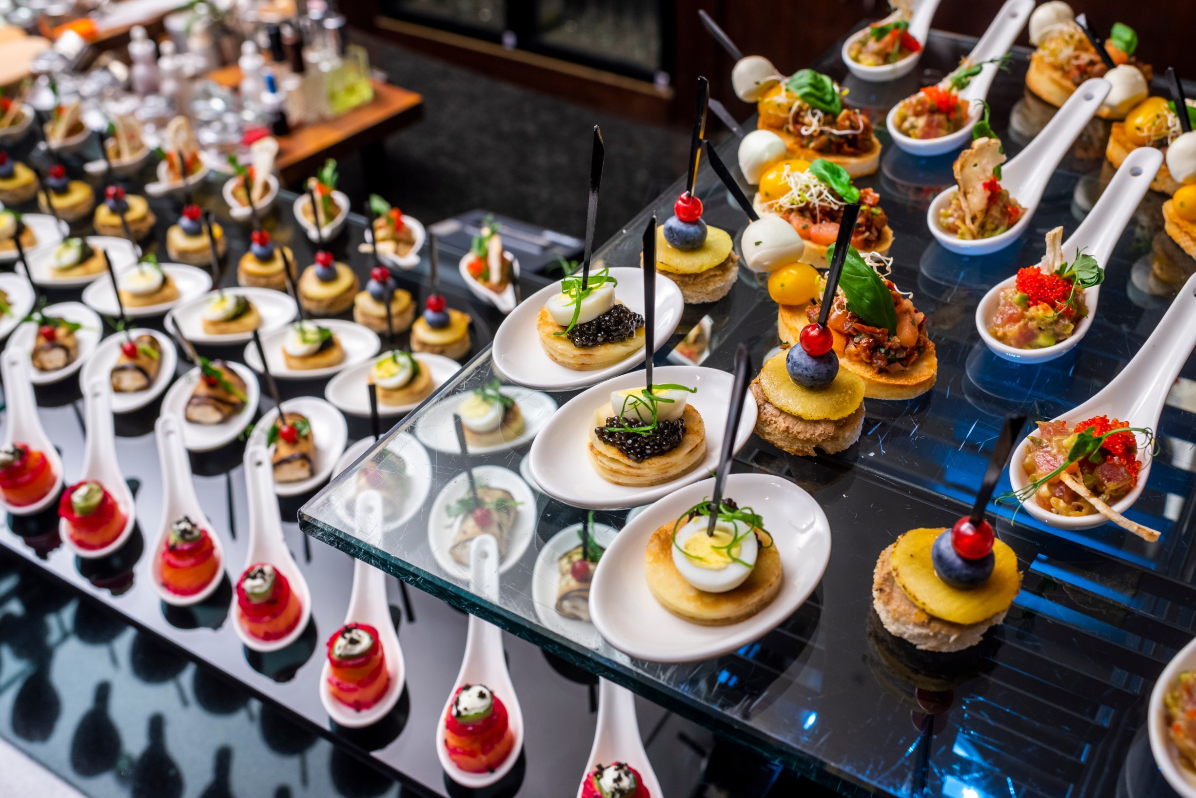 A buffet table with caviar appetizers