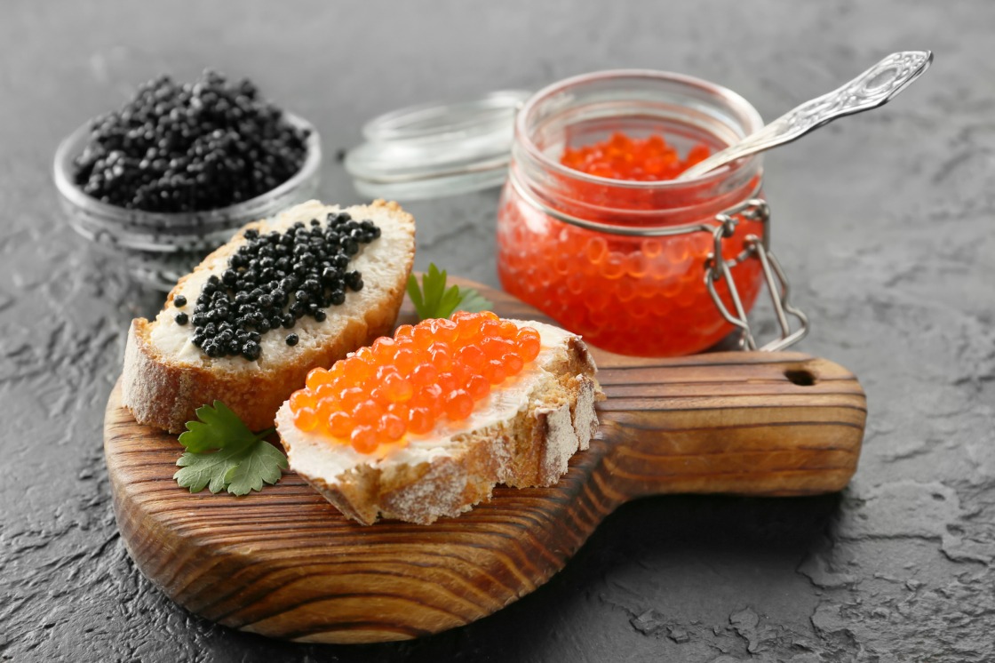 An assortment of caviar and roe served with bread