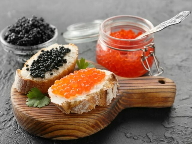 An assortment of caviar and roe served with bread